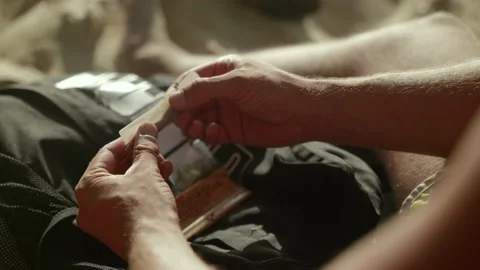 Rolling a marihuana cigarette joint. Stock Footage 151610971