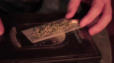 Rolling a Marijuana Joint Stock Footage 39715260