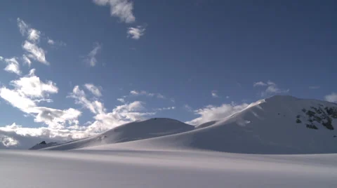 Rolling mountains in sunlight and blue sky, Antarctica Stock Footage 34312835