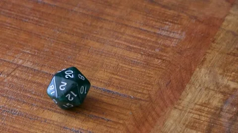 Rolling a natural 20 on a D20 Stock Footage 335944785