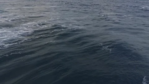 Rolling Ocean Waves and White Surf Across Blue Sea Vidéo 347636256