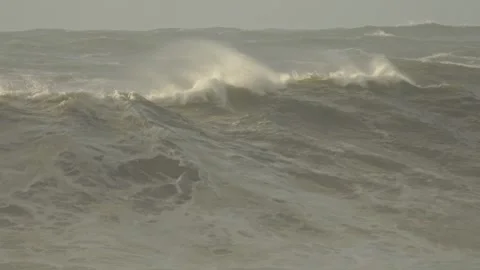 Rolling Ocean Waves Crash Onto Wild Seaside After a Storm at Sunset Stock Footage 341684006