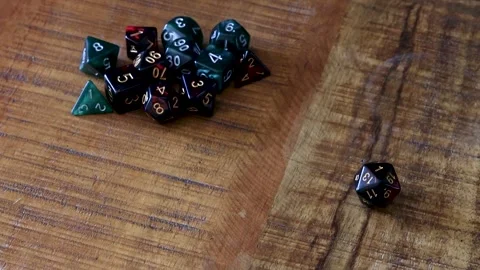 Rolling a one on a D20 Dice Stock Footage 335946597