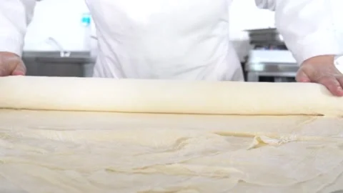Rolling out dough in the bakery Stock Footage 153703729