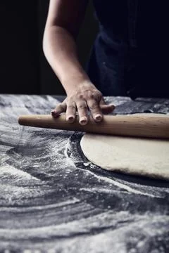 Rolling Out Dough on Floured Surface Stock Photos