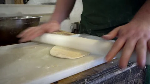 Rolling out dough by hand Stock Footage 321827735