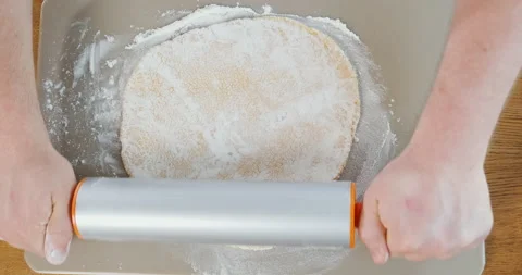 Rolling out the dough, kneading. Chef cooks pizza or baking pie. Homemade pasta Stock Footage 133243168