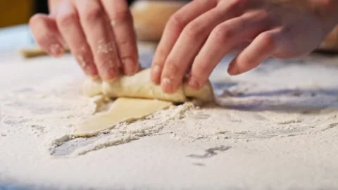 Rolling out dough in process of making croissants Stock Footage 148728282