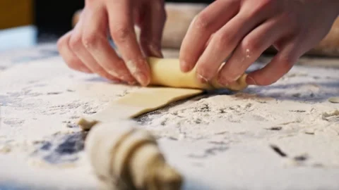 Rolling out dough in process of making croissants Stock Footage 148793254