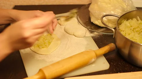Rolling out dough with a rolling pin in hand Stock Footage 57336829