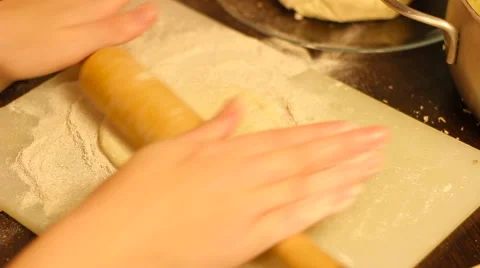 Rolling out dough with a rolling pin in hand Video stock 57338457