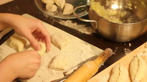 Rolling out dough with a rolling pin in hand Stock Footage 57347611