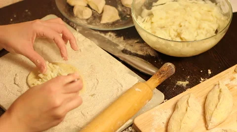 Rolling out dough with a rolling pin in hand Stock Footage 57352057