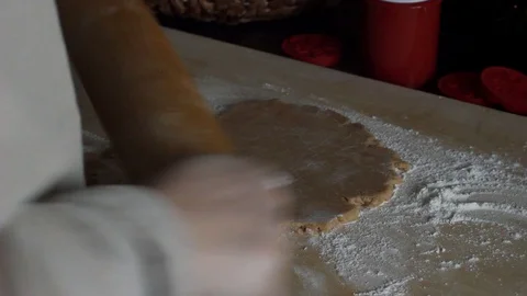 Rolling out the dough with a rolling pin. Preparation of ginger cookies. Stock Footage 129179075