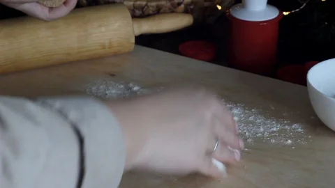 Rolling out the dough with a rolling pin. Preparation of ginger cookies. Stock Footage 129179682