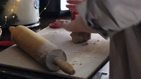 Rolling out the dough with a rolling pin. Preparation of ginger cookies. Stock Footage 129179777