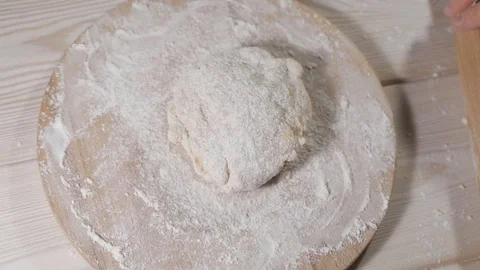 Rolling out a dough in slow motion Video stock 122429206