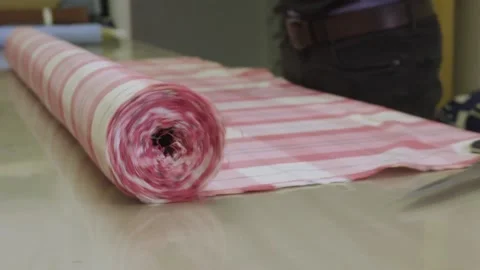 Rolling out fabric on the table Video stock 139719702