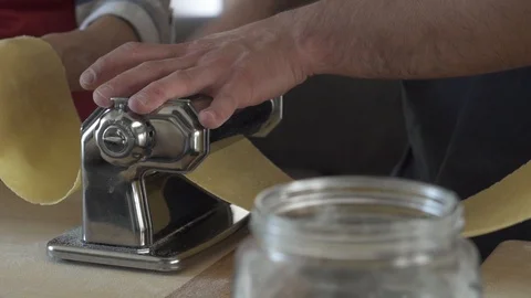 Rolling Out Pasta with a Old Machine Stock Footage 85884841