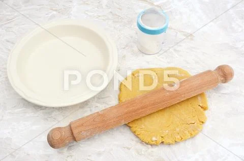 Rolling out shortcrust pastry for a pie Stock Photos