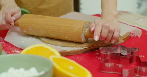 Rolling out sugar cookie dough to bake Christmas cookies. Stock Footage 142063663
