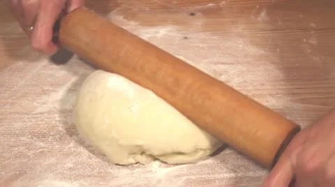 Rolling out yeast dough Stock Footage 24673402