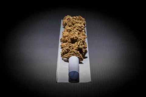 Rolling paper with filter and marijuana Stock Photos