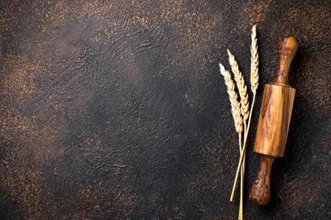 Rolling pin and wheat ears Stock Photos