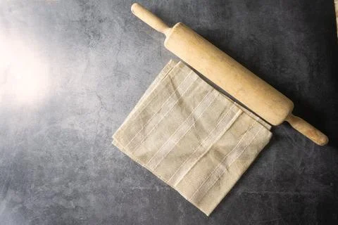 Rolling pin on dark floor Foto stock