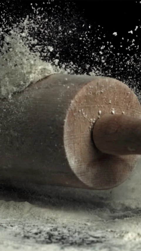 The rolling pin falls into the flour. Filmed on a high-speed camera at 1000 fps Stock Footage 335357964
