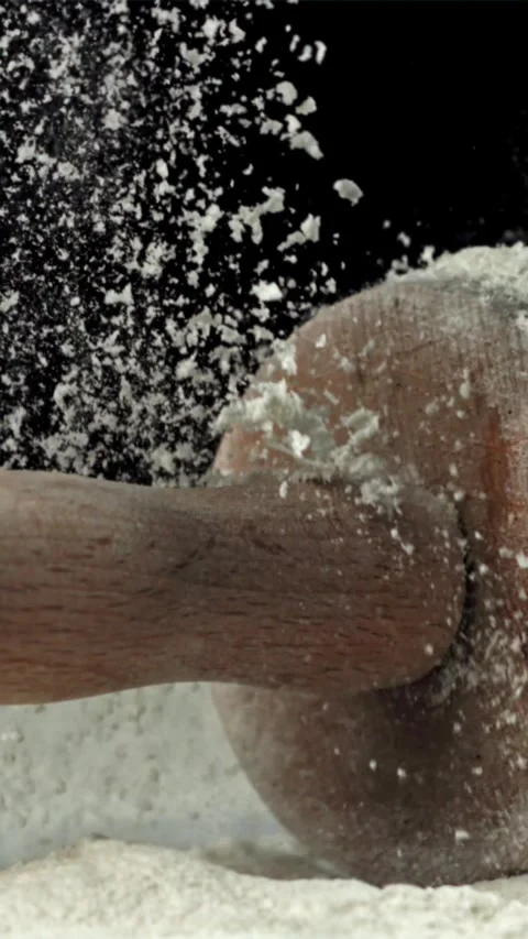 The rolling pin falls into the flour. Filmed on a high-speed camera at 1000 fps Stock Footage 335359226