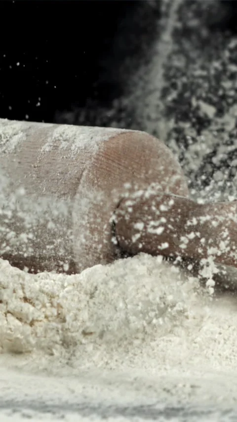 The rolling pin falls into the flour. Filmed on a high-speed camera at 1000 fps Stock Footage 335360696