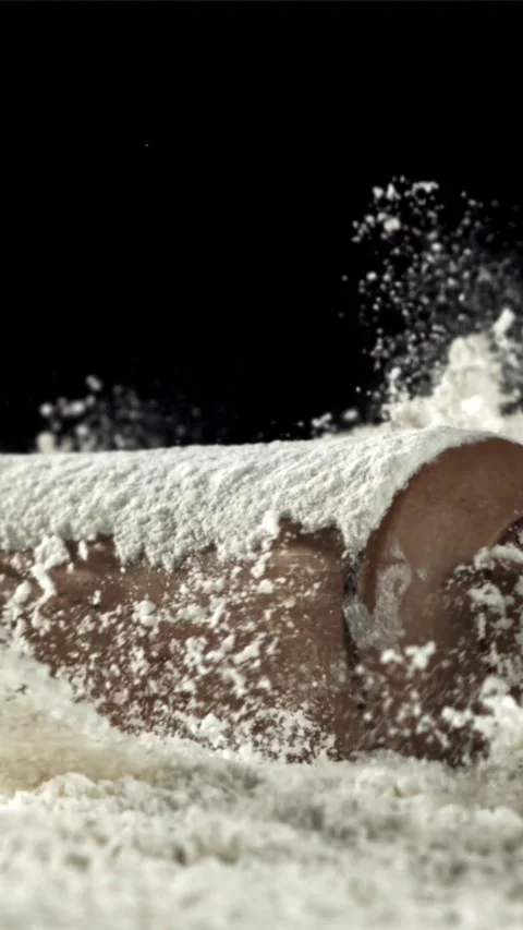 The rolling pin falls into the flour. Filmed on a high-speed camera at 1000 fps Stock Footage 335362096