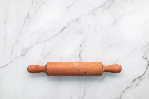 The rolling pin set up on white marble background. Baking background with the Stock Photos