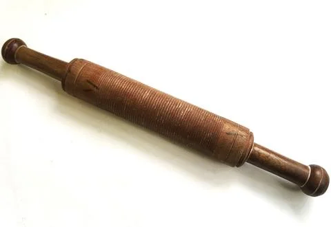 A rolling pin on white background. Stock Photos