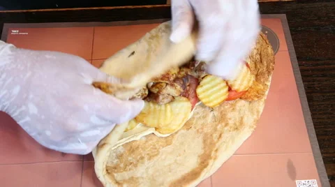 Rolling pita with doner Stock Footage 64327969