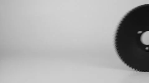 Rolling plastic gears in white and black, isolated on a white background. Stock Footage 111534895