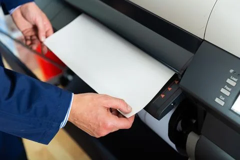 Rolling plotter printer in work Stock Photos