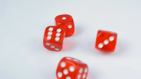 Rolling Red Casino Dice on White Table Slow Motion Video stock 121311642