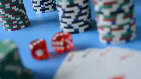 Rolling red dice on background of chips and cards. Stock Footage 22007554