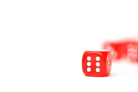 Rolling red dice isolated on white Stock Photos