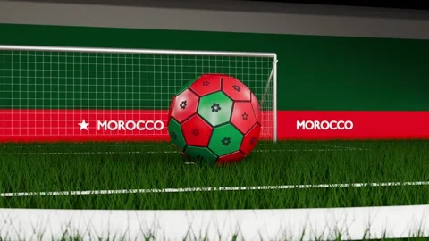 Rolling red green soccer ball hitting turf after camera pullback, crossing goal Video stock 333286144