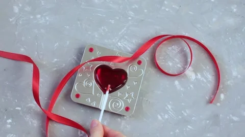 Rolling red heart from a mold Stock Footage 146949058