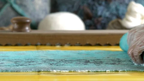 Rolling in a roll of felt wool Stock Footage 88957931