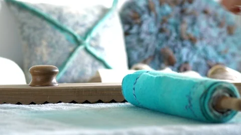 Rolling in a roll of wool felt using Rubel. Stock Footage 88960119
