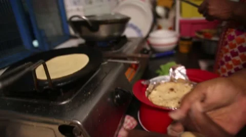 Rolling Roti dough Stock Footage 65787417