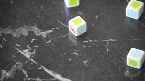 Rolling RPG board game dice on a black marble table Stock Footage 130462890