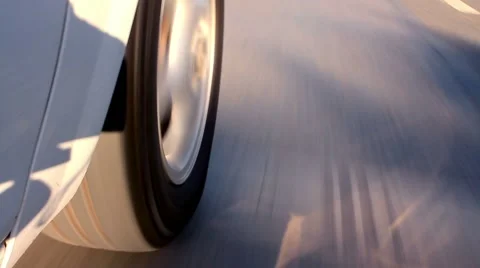 Rolling rubber tire of white car on the asphalt road Stock Footage