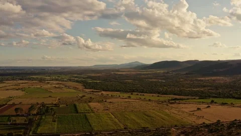 Rolling Rural Landscape With Fields and Cloudy Horizon, Aerial Drone View Video stock 334648522