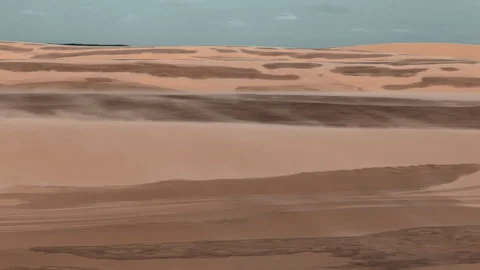 Rolling sand dunes stretch across the horizon, their smooth curves interrup.. Stock Footage 308327895
